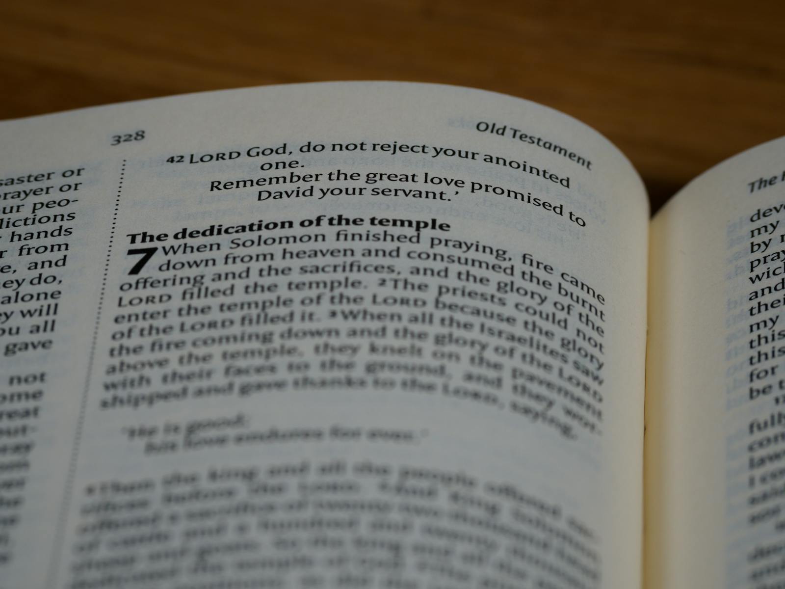 A close-up image of a Bible open to the Old Testament, showing text on the dedication of the temple.
